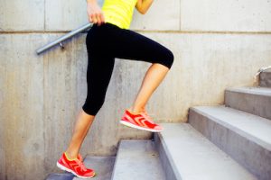 Woman running up the stairs, interval training