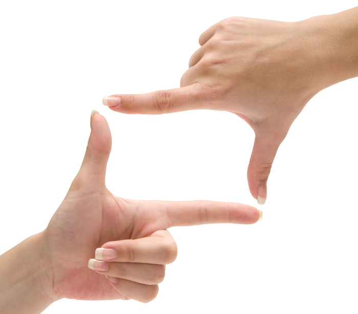 Hands forming a frame. Isolated on a white background.