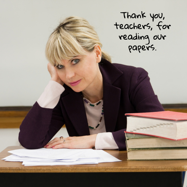 Woman grading papers at desk