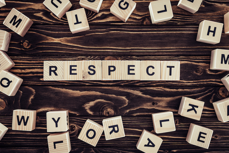 The word "Respect" spelled with wooden tiles