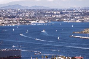 boats leaving wakes in the San Diego harbor