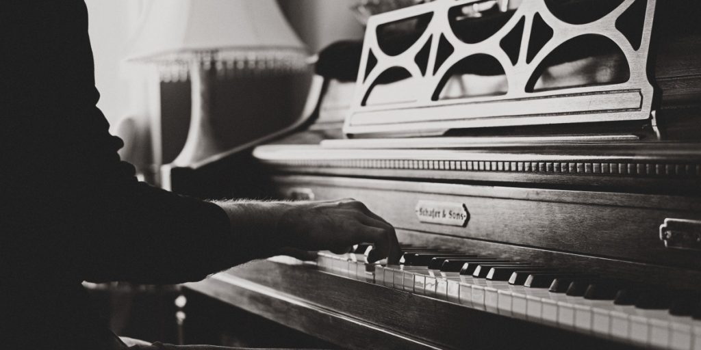 Hands of person playing piano