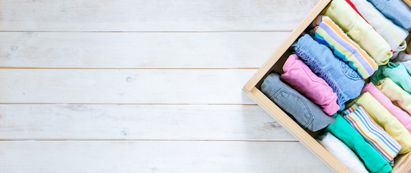 Neatly folded clothes in drawer