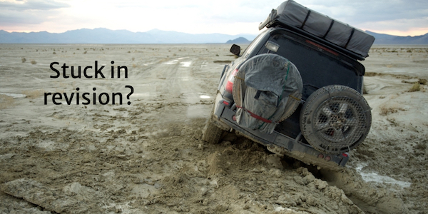 Image of truck stuck in the mud in the desert.