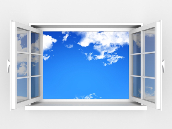 window open to blue sky and clouds