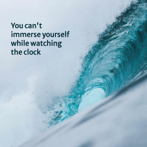 Image of surf, with words "You can't immerse yourself while watching the clock."