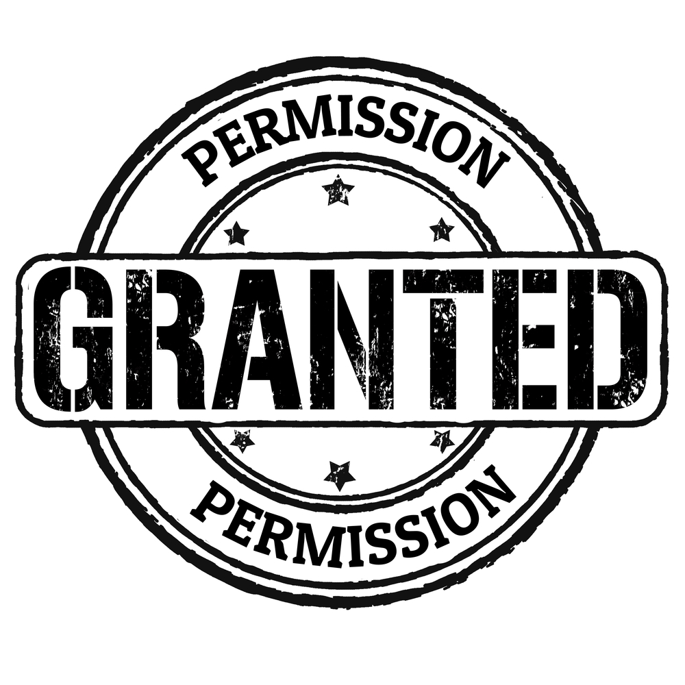 Permission granted rubber stamp on white