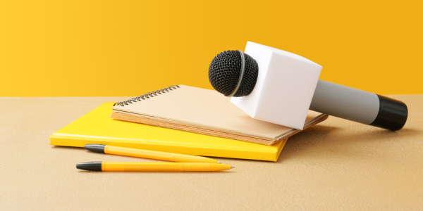 Microphone on top of writing pads and lens
