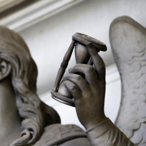 angel statue holding hourglass